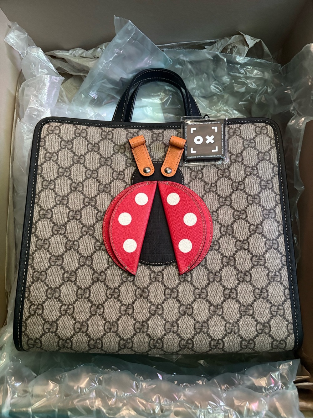 Gucci Beige GG Canvas Tote with Red Ladybug Appliqué and Black Trim